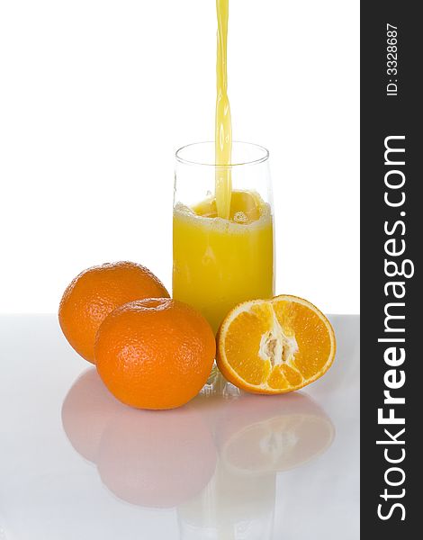 Orange juice pouring into a glass
