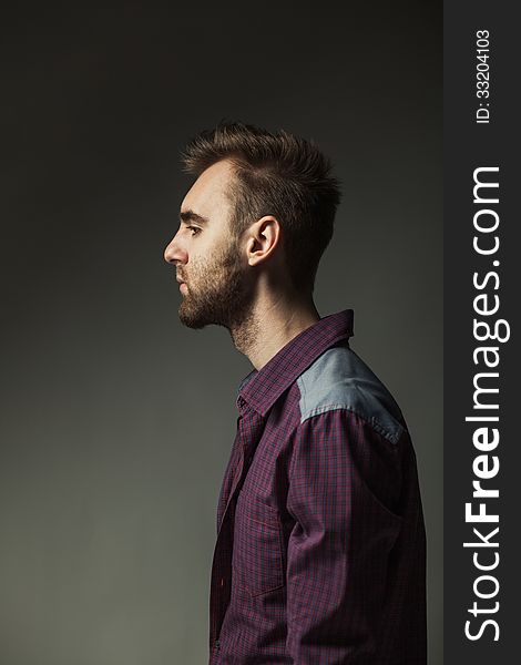 Young Adult Man On A Dark Background