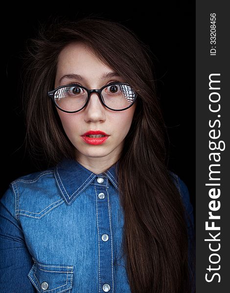 Young Woman On A Dark Background