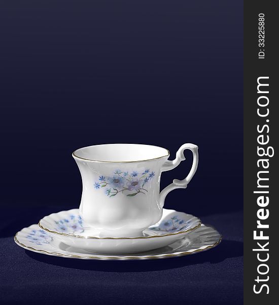 Vintage tea cup on blue background. Vintage tea cup on blue background