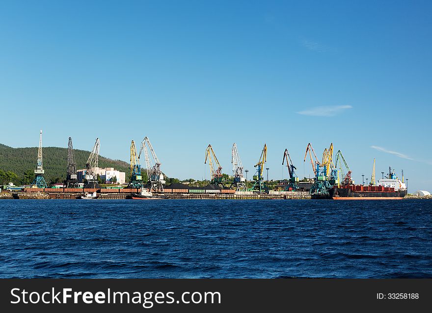 Port with cranes and ships, cargo ship