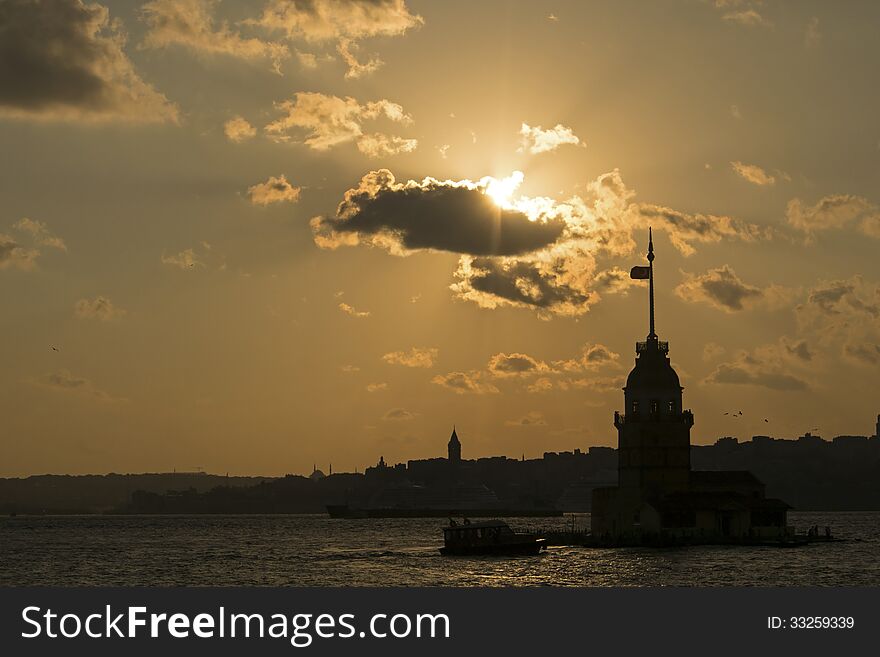 Silhouette of the Maiden's Tower in Istanbul, Turkey at the sunset. Which is standing in the middle of the Istanbul Bosphorus. Silhouette of the Maiden's Tower in Istanbul, Turkey at the sunset. Which is standing in the middle of the Istanbul Bosphorus.
