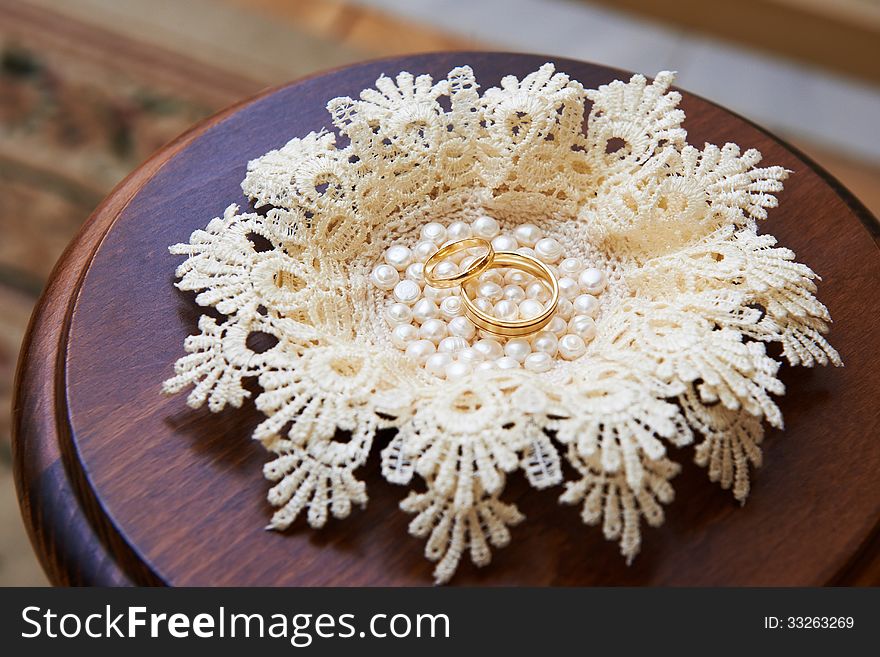 Wedding ring for newlyweds on little table