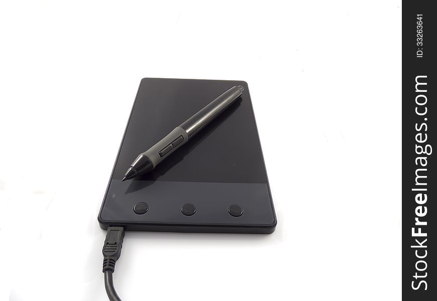 Black graphic tablet with pen isolated on white background