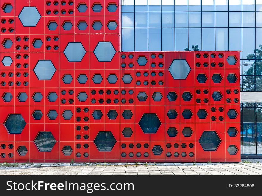 Modern red outer wall with geometry shape windows. Modern red outer wall with geometry shape windows