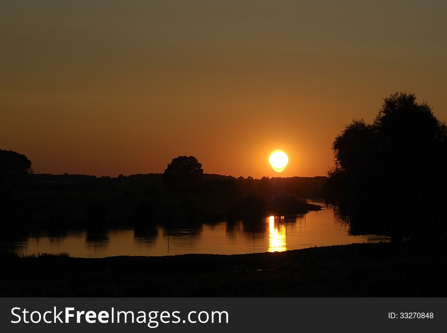 Sunset along the river in the Netherlands