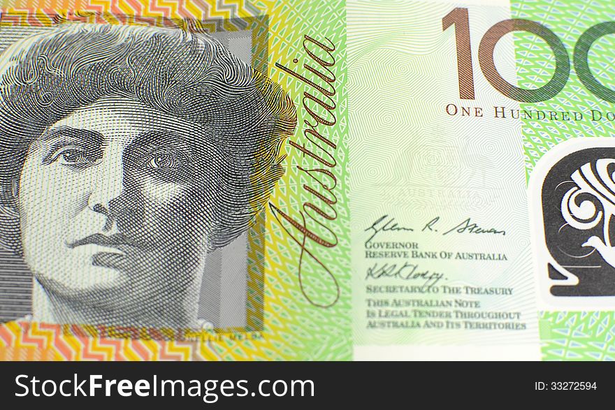 Australian green and gold 100 hundred dollar note, against a black background. Australian green and gold 100 hundred dollar note, against a black background.