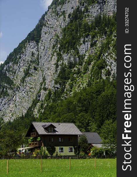 House under the alps mountains cliff. House under the alps mountains cliff