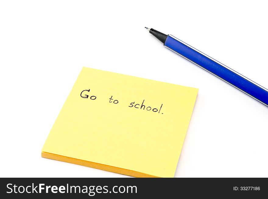 Go to school word on orange post it with blue pen isolated on wh