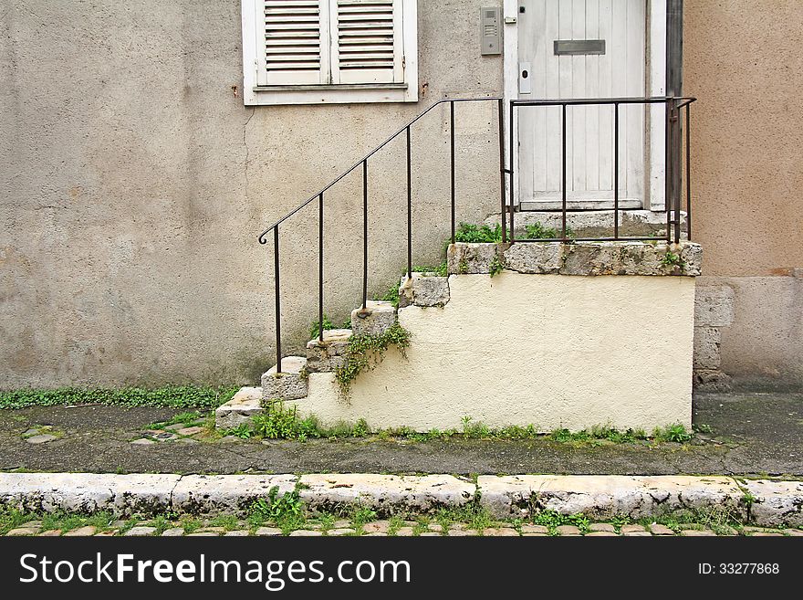 Old stone steps, wooden door and window