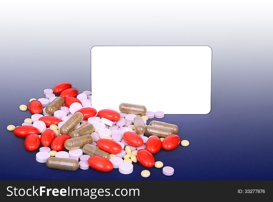 A lot of colorful pills. space for text. blue gradient background. A lot of colorful pills. space for text. blue gradient background.