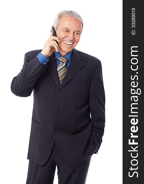Image of a senior businessman talking on cell phone and smiling, isolated on white. Image of a senior businessman talking on cell phone and smiling, isolated on white