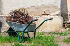 Wheelbarrow Near The Old Wall Stock Photography Wheelbarrow Near The Old Wall Stock Photography