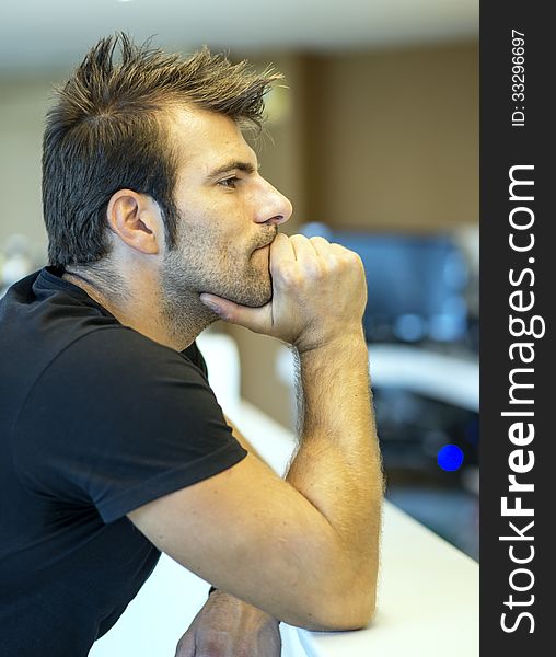 Thoughtful man sitting in the bar.