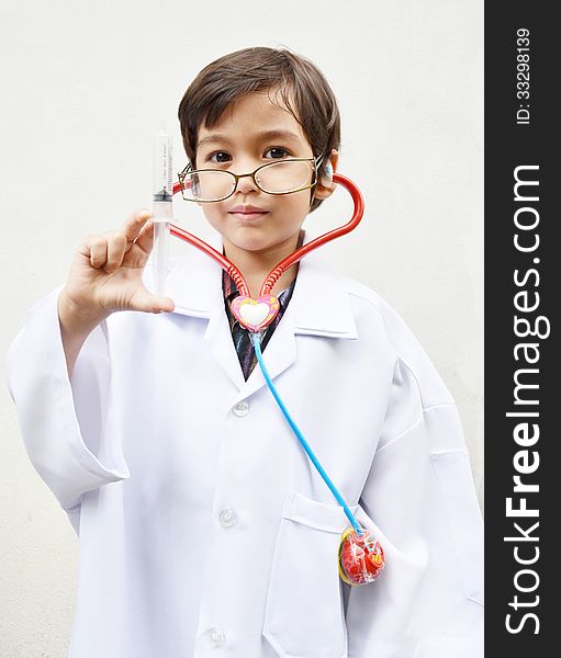 Little boy pretending to be a doctor portrait