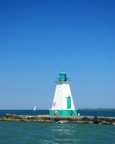 Lighthouse At End Of Pier Royalty Free Stock Photos