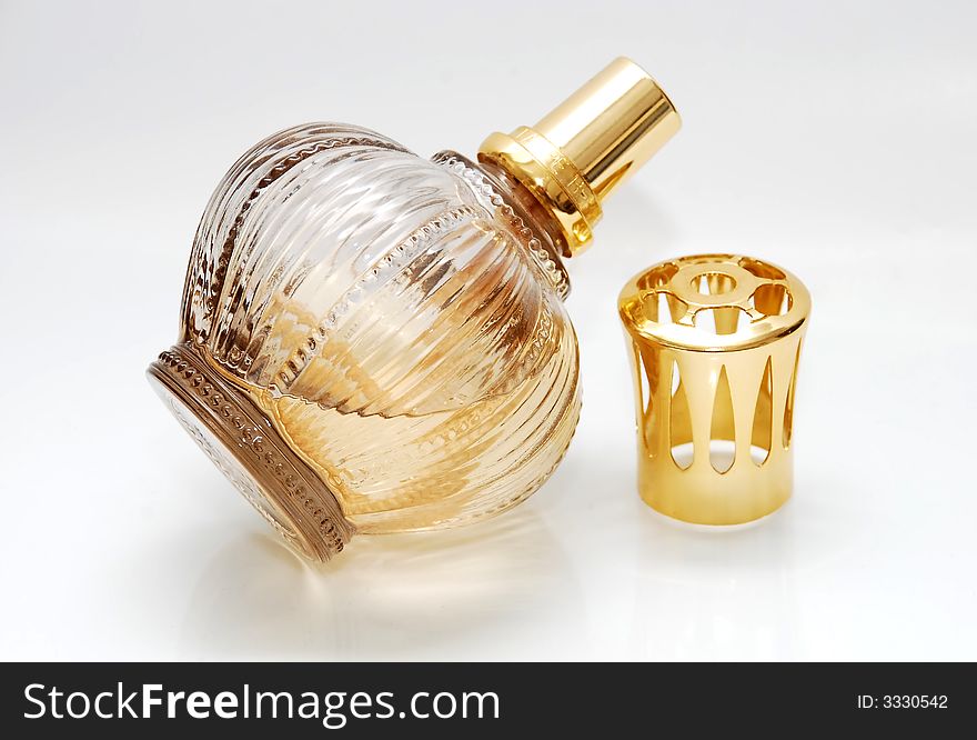 Bottle of perfume isolated over a white background. Bottle of perfume isolated over a white background