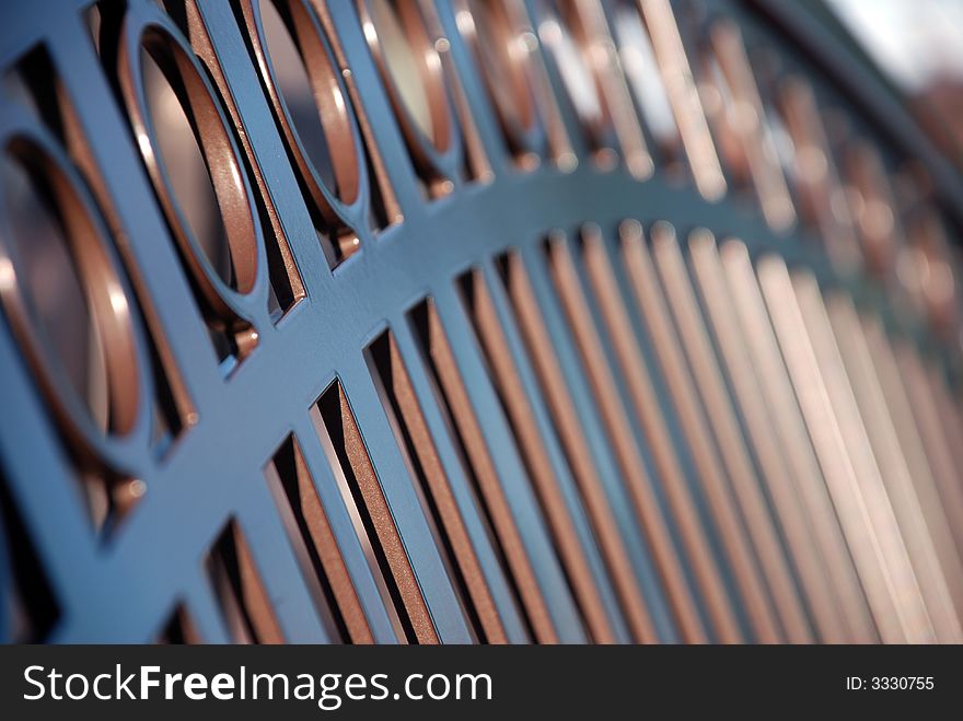 A closeup of part of metal bench. A closeup of part of metal bench.