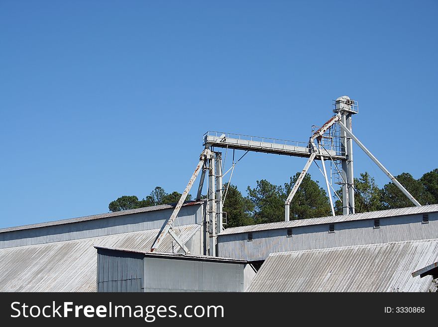 A Peanut Processing Plant against a blue sky