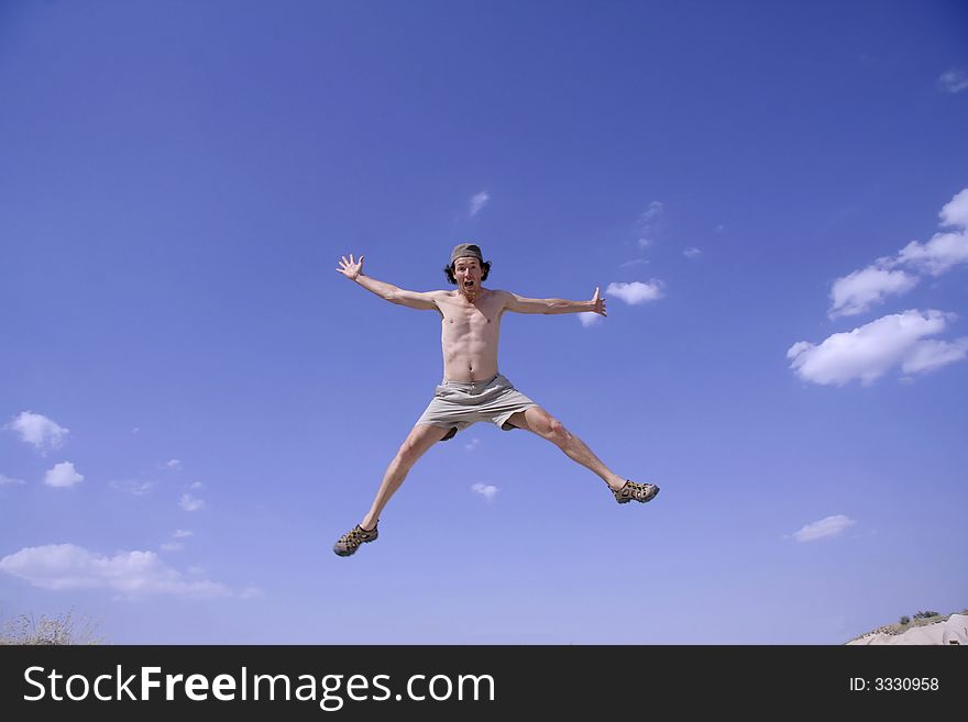 Healthy happy man jumping in joy of life