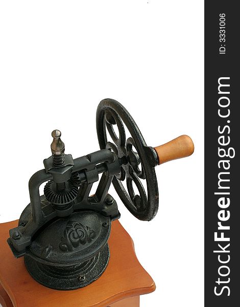 A detail of a heavy cast-iron grinding mechanism on top of a coffee grinder, isolated.