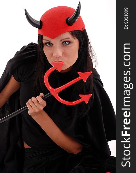 Studio shot of girl dressed as the devil for Halloween