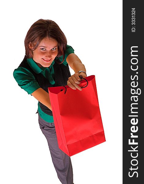 A business lady holding a red shopping bag and pretending to give it to someone. A business lady holding a red shopping bag and pretending to give it to someone