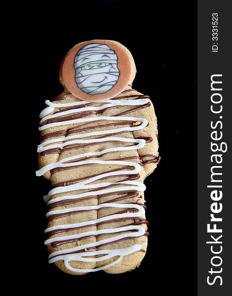 Delicious decorated yummy gingerbreadman on a dark night. Delicious decorated yummy gingerbreadman on a dark night