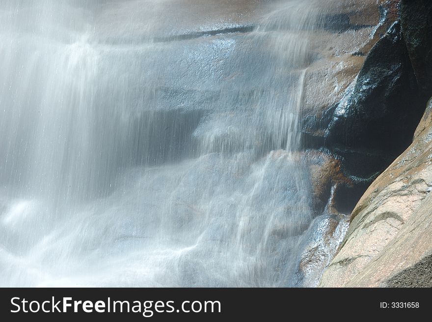 A waterfall in the mountain , China. A waterfall in the mountain , China.