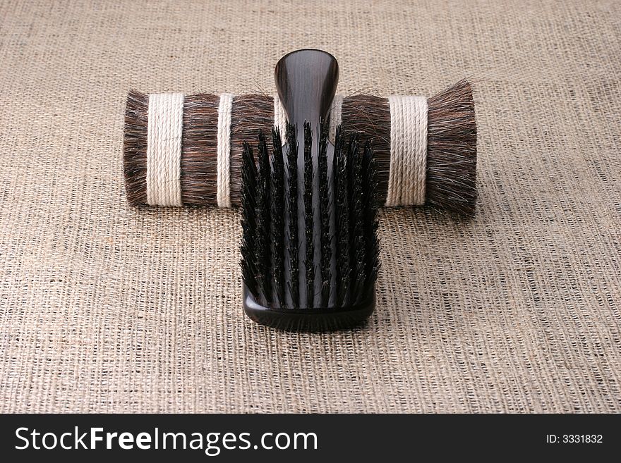 Men's comb. Expensive wooden comb lying on the cloth.