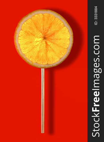 Natural lollipop with orange fruit