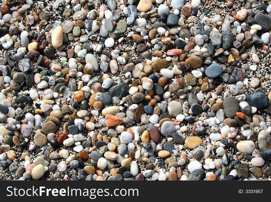 Stones background down the beach