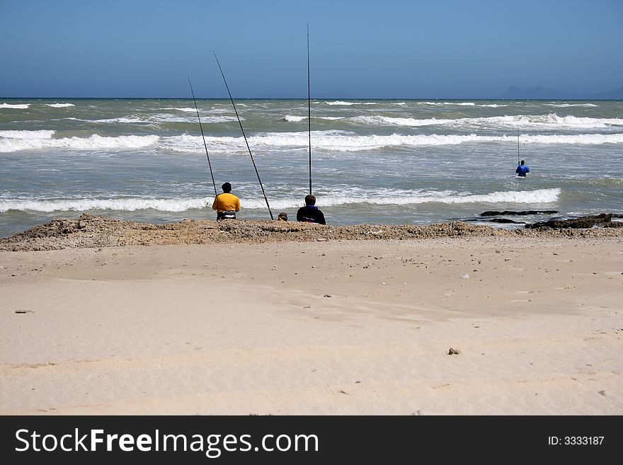 Four Fisherman at a beach near Macassar, South Africa