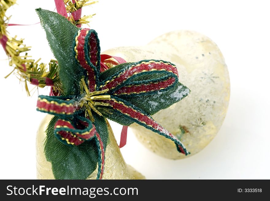 Two golden christmas bells on white background.