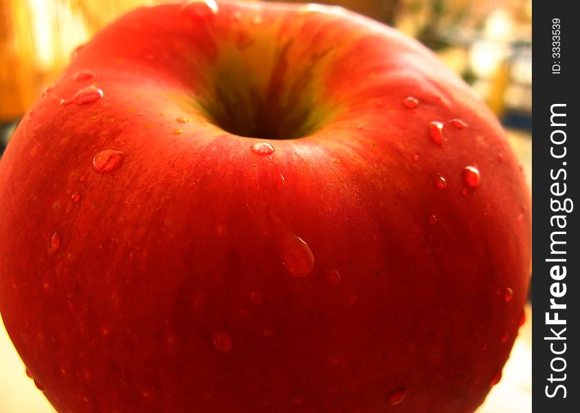 Red apple close-up with drops of water. Fresh