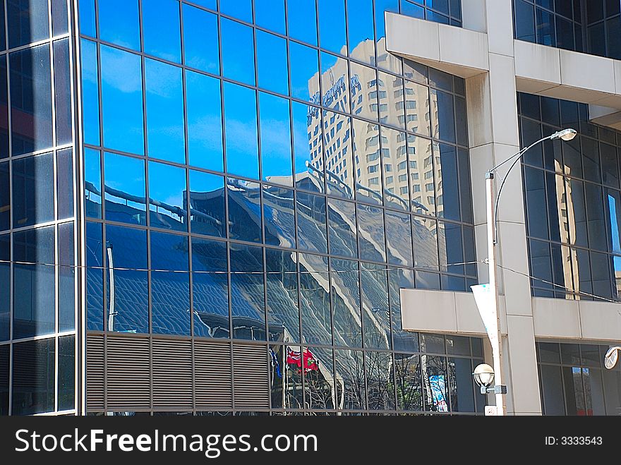 Reflections in mirror window of the skyscraper in centre Toronto. Reflections in mirror window of the skyscraper in centre Toronto