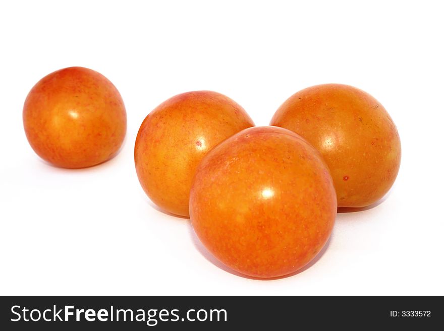 Big four plums isolated on the white.