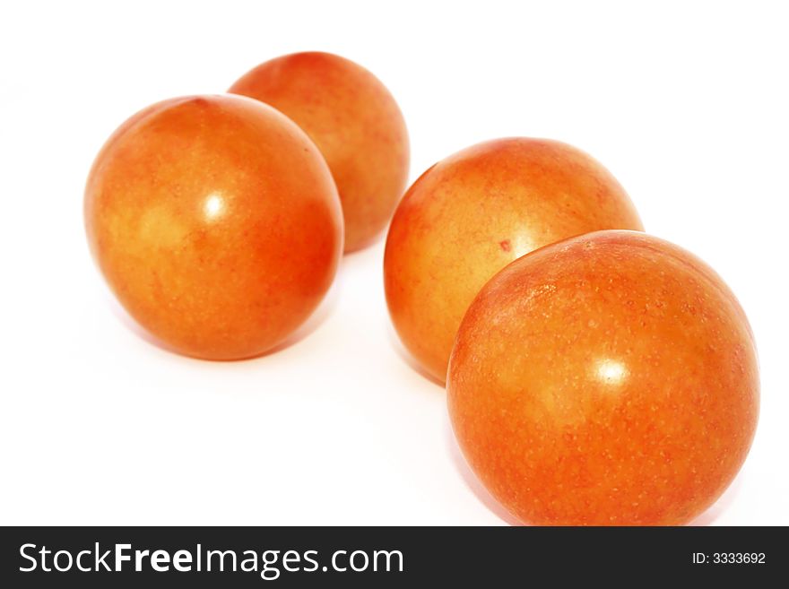 Big four plums isolated on the white.