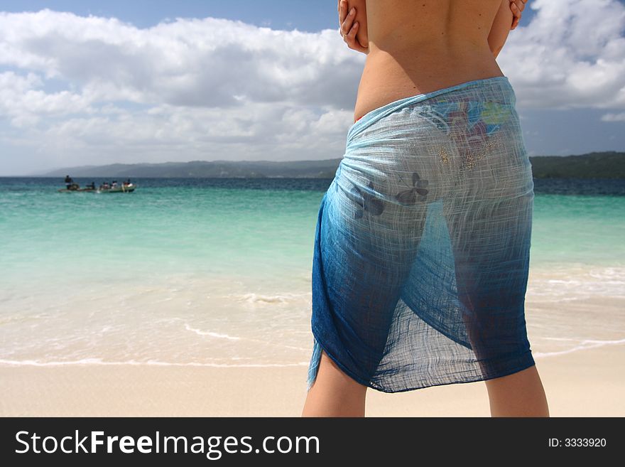 Young model at white sandy beach. Young model at white sandy beach