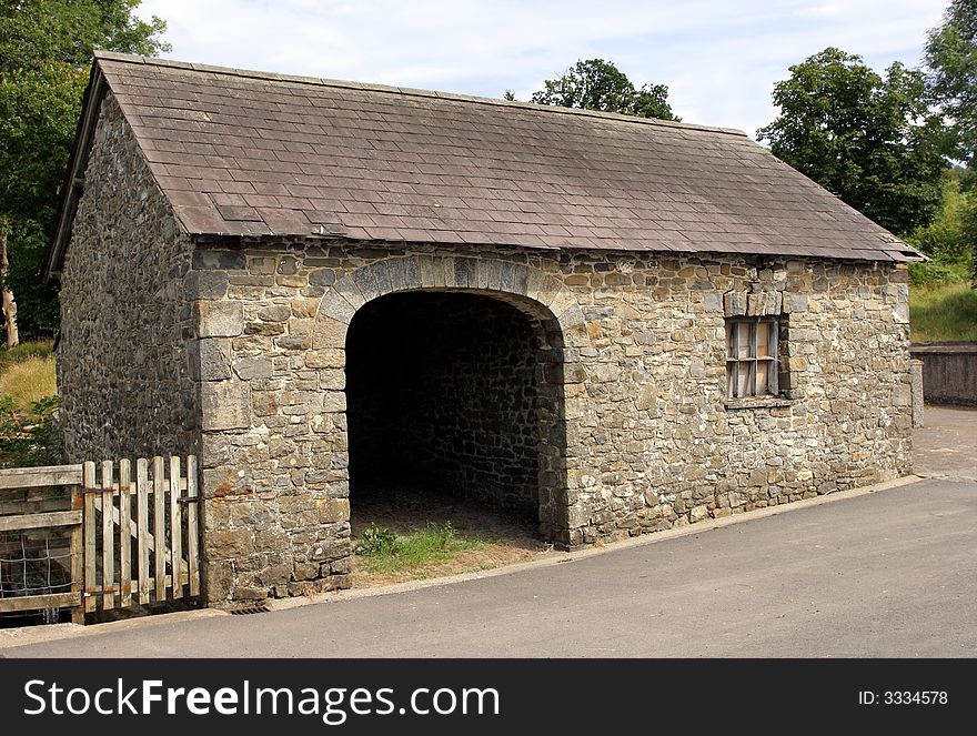 Old semi derelict small stone barn with large cart opening to the front. Old semi derelict small stone barn with large cart opening to the front.