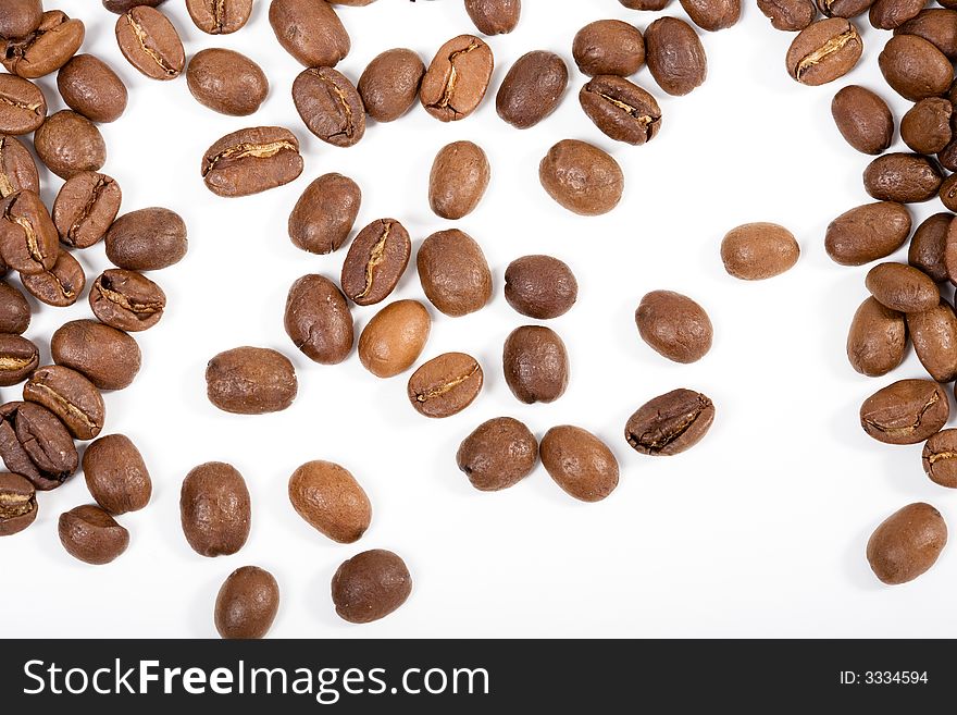 Bunch of good smelling Espressobeans. Top View. On white background. Bunch of good smelling Espressobeans. Top View. On white background.