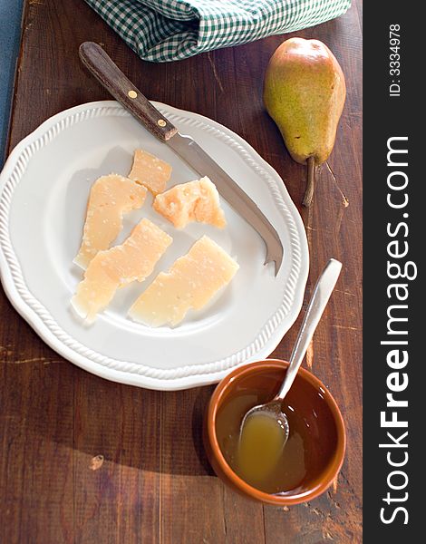 Healthy breakfast, parmisan cheese, pear and honey. Healthy breakfast, parmisan cheese, pear and honey