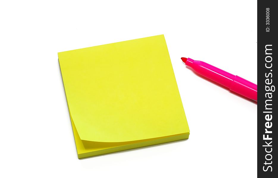 Yellow sticky pad for reminders with pen