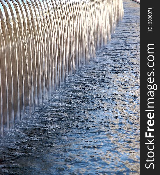 A close up of a blue water fountain