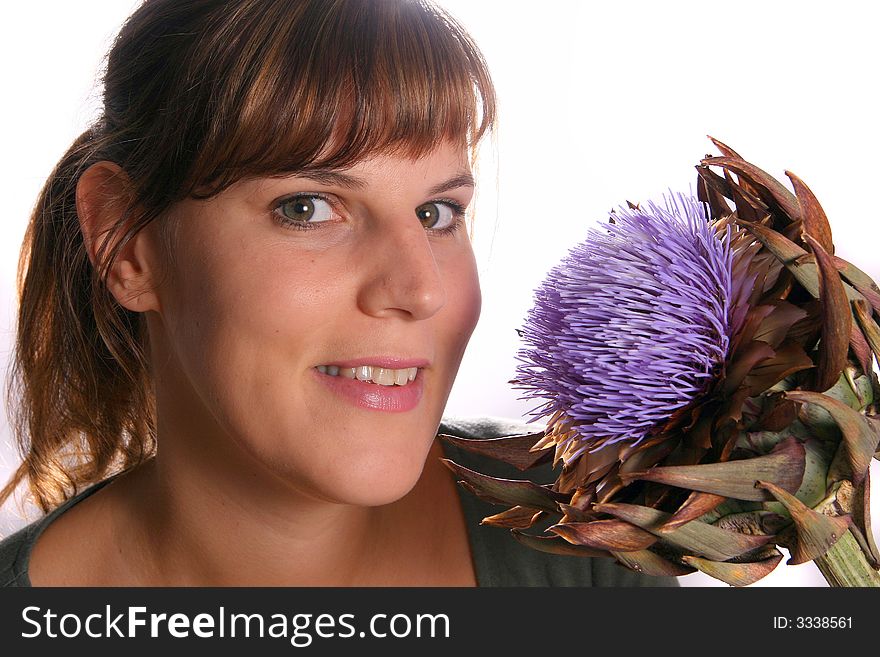 A young woman with a beautiful flower!. A young woman with a beautiful flower!