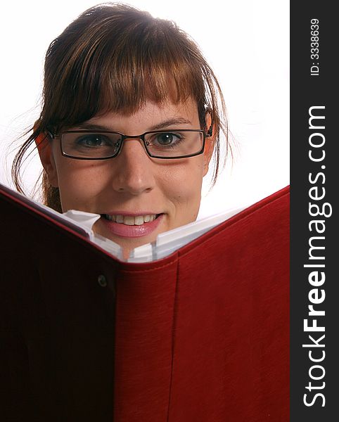 A young student is reading a book.