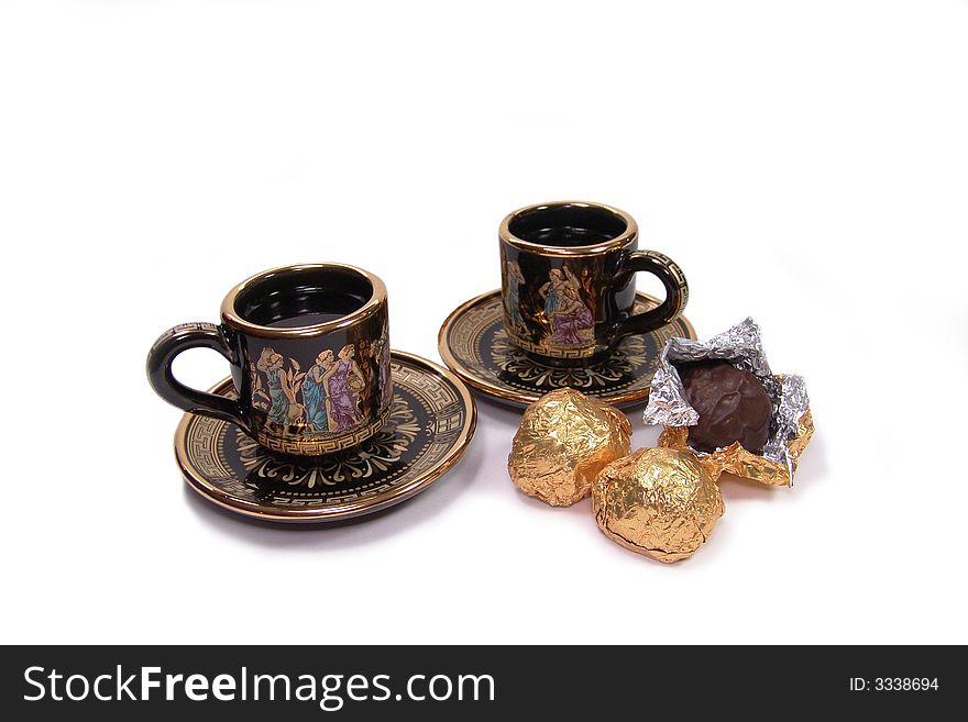 Two painted cups of coffee and sweet on a white background. Two painted cups of coffee and sweet on a white background.