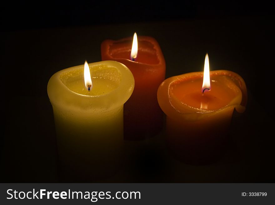 Three romantic candles in the autumn time