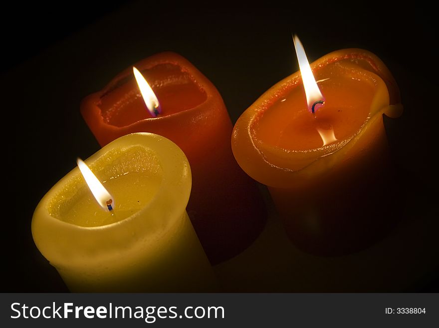 Three romantic candles in the autumn time