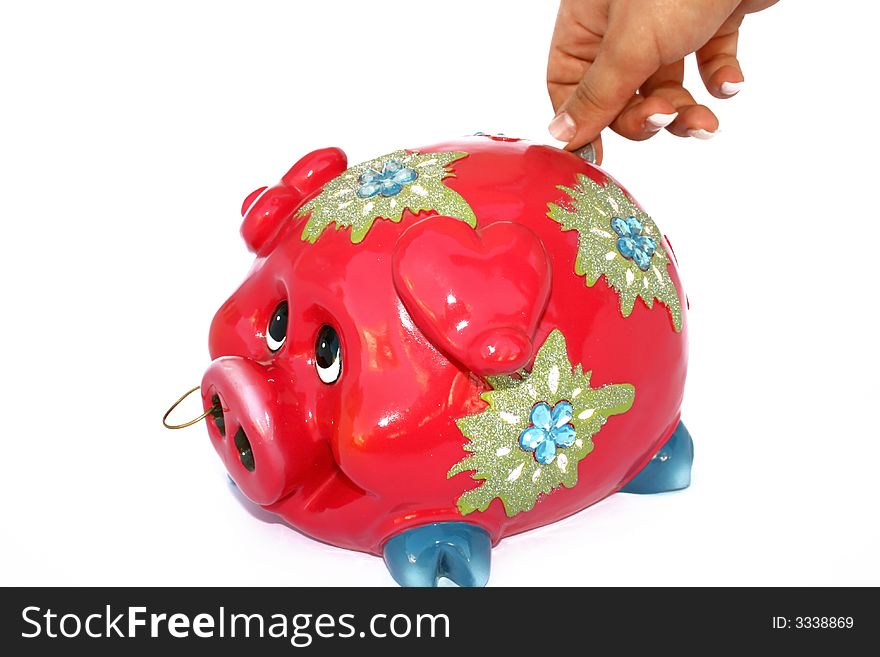 Red piggy bank isolated on the white.